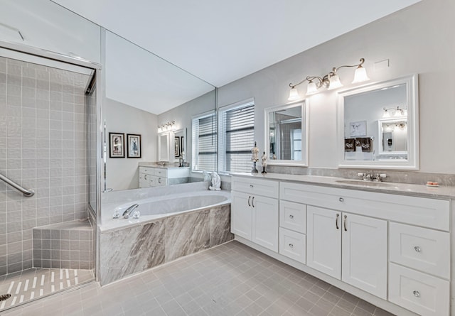 bathroom with tile patterned flooring, vanity, independent shower and bath, and lofted ceiling