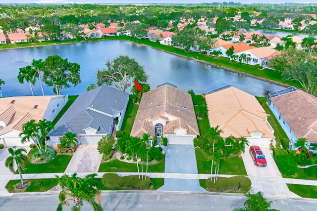 birds eye view of property featuring a water view