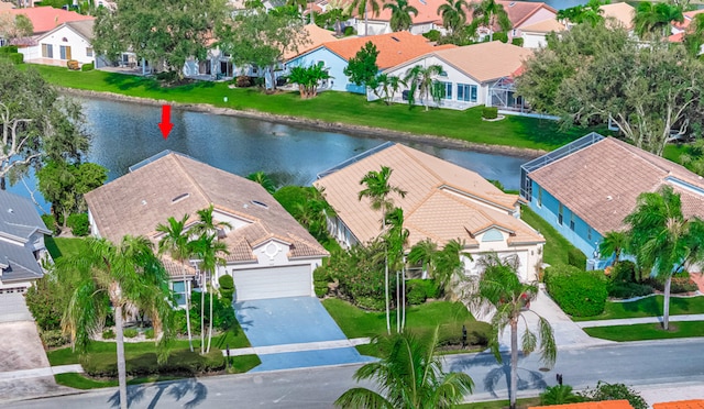 drone / aerial view with a water view