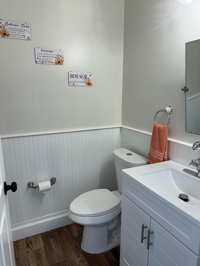 bathroom featuring hardwood / wood-style floors, vanity, and toilet