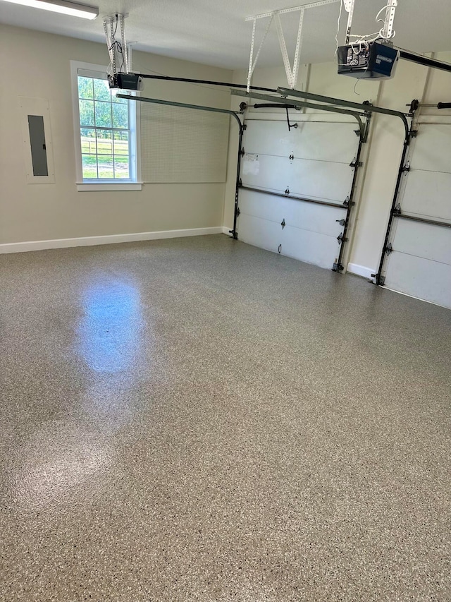 garage with electric panel and a garage door opener