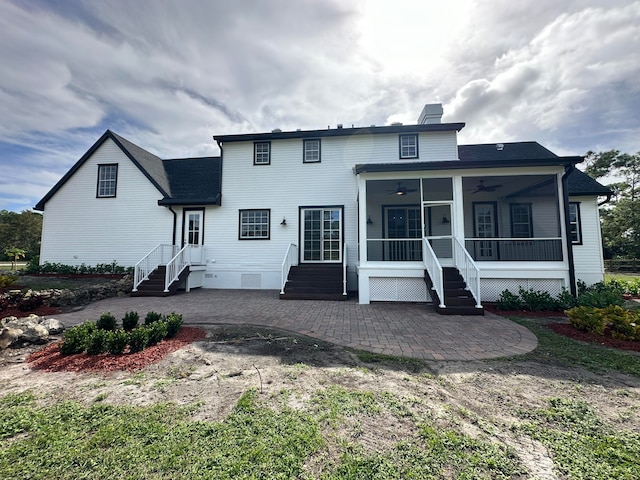 back of house with ceiling fan and a patio area