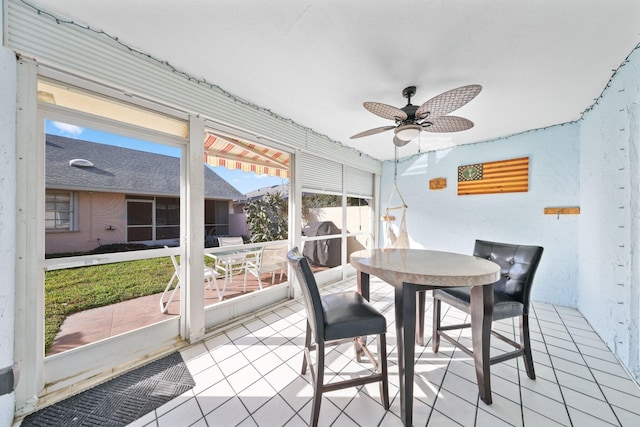 sunroom / solarium with ceiling fan