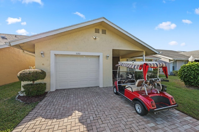 garage featuring a yard