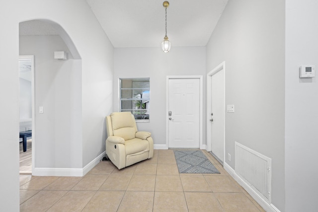 foyer entrance featuring light tile patterned floors