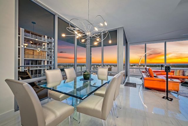 dining area with floor to ceiling windows and a chandelier