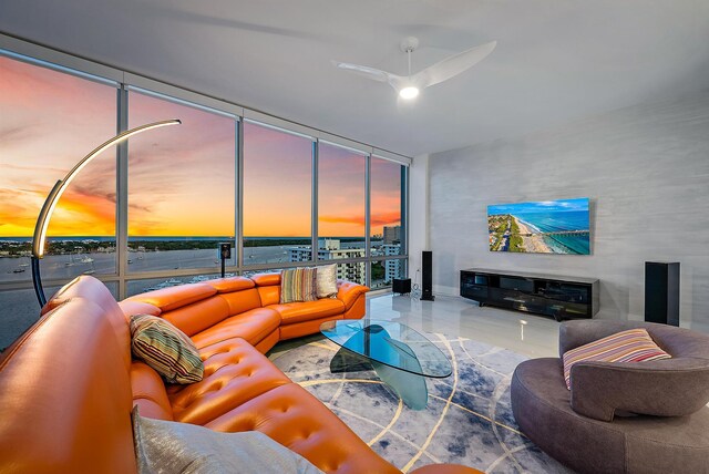 dining space featuring floor to ceiling windows and a chandelier