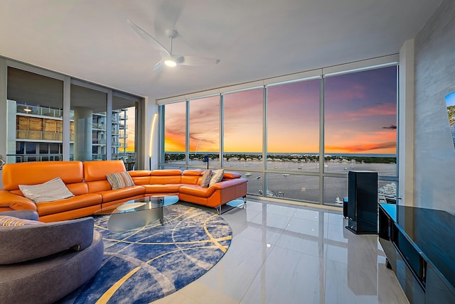 living room with ceiling fan and floor to ceiling windows