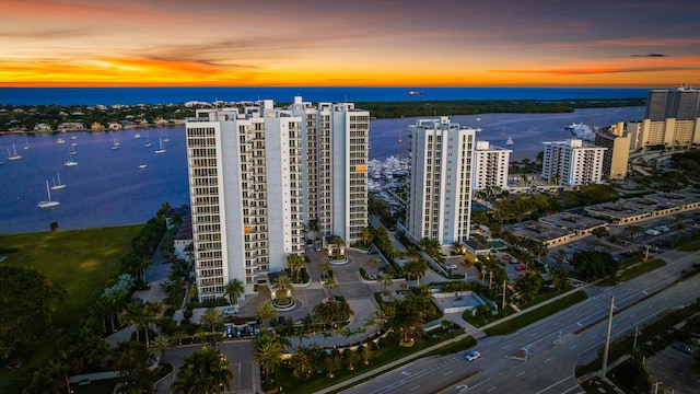 drone / aerial view featuring a water view and a city view