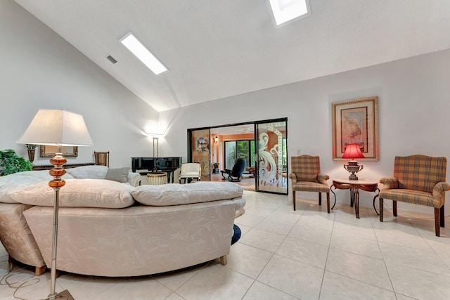 living room featuring light tile patterned flooring and vaulted ceiling