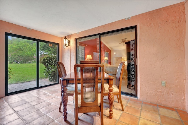 dining area with vaulted ceiling