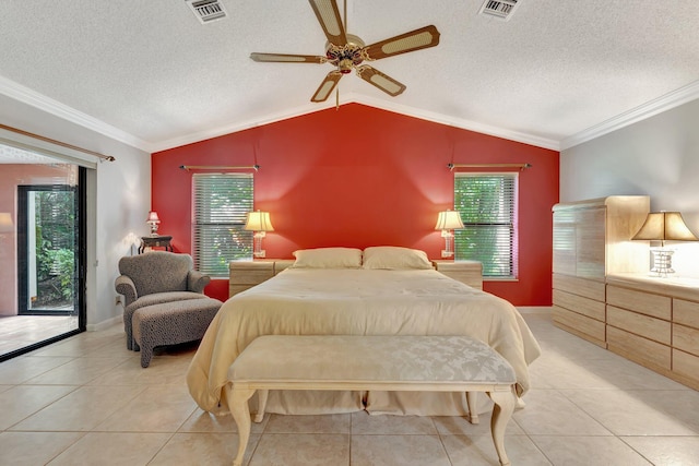 tiled bedroom featuring ceiling fan, multiple windows, vaulted ceiling, and access to outside