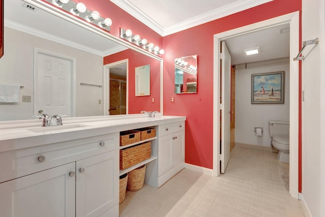 bathroom featuring ornamental molding, vanity, and toilet