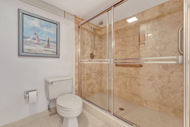 bathroom with toilet, an enclosed shower, and tile patterned flooring