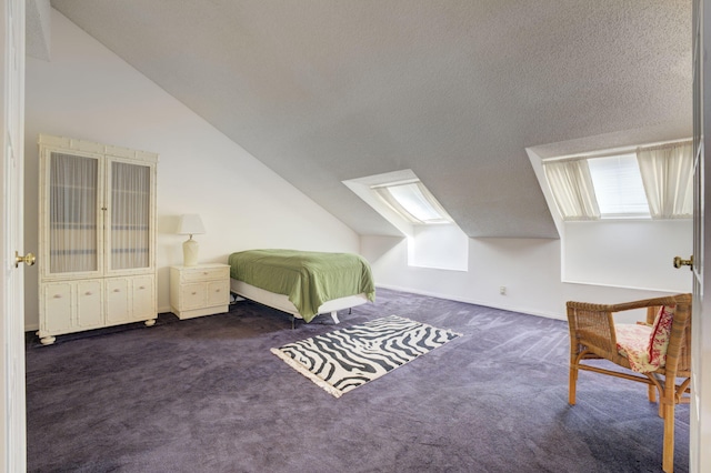 carpeted bedroom with multiple windows, a textured ceiling, and vaulted ceiling