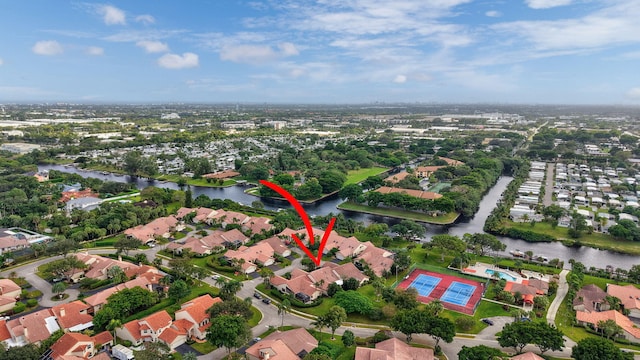 birds eye view of property featuring a water view