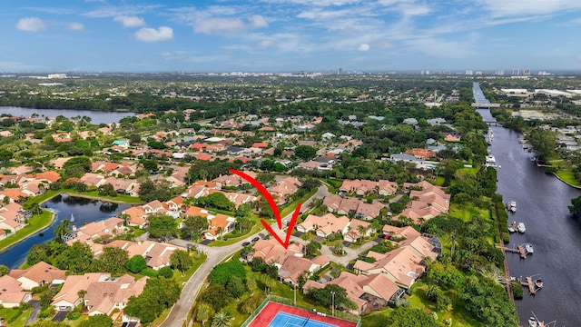 birds eye view of property featuring a water view