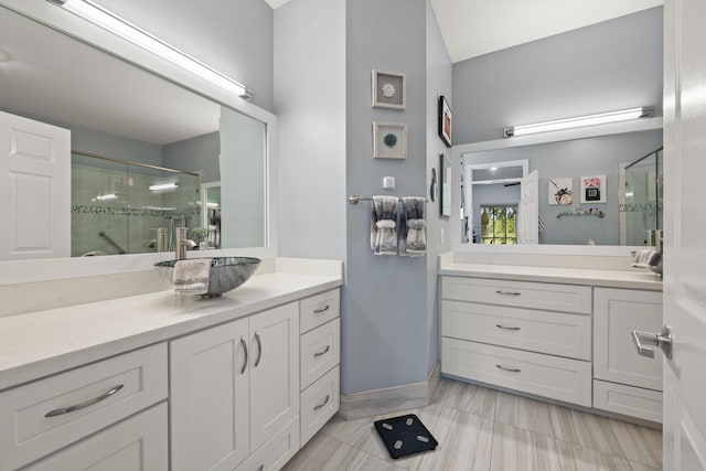 bathroom featuring vanity, an enclosed shower, and tile patterned flooring