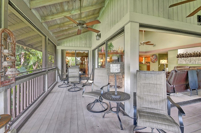 sunroom with wooden ceiling and vaulted ceiling with beams