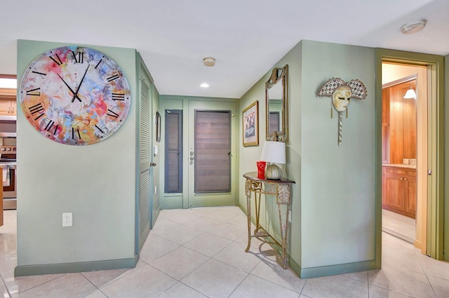 hall with light tile patterned flooring