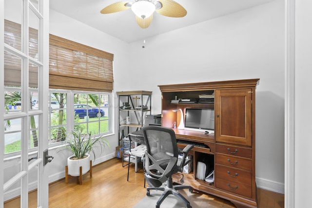 office with ceiling fan and light wood-type flooring