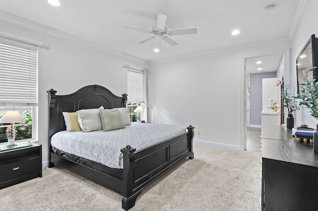 bedroom with ensuite bathroom, ceiling fan, light carpet, and crown molding