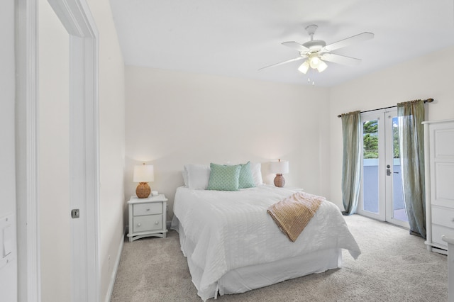 bedroom with access to outside, french doors, light colored carpet, and ceiling fan