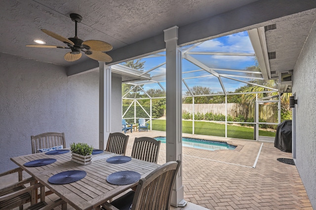 view of patio with a lanai and ceiling fan