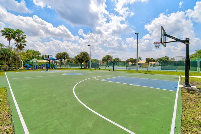 view of sport court featuring a playground