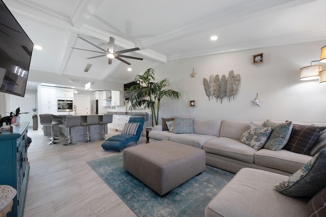 living room featuring vaulted ceiling with beams, ceiling fan, and ornamental molding