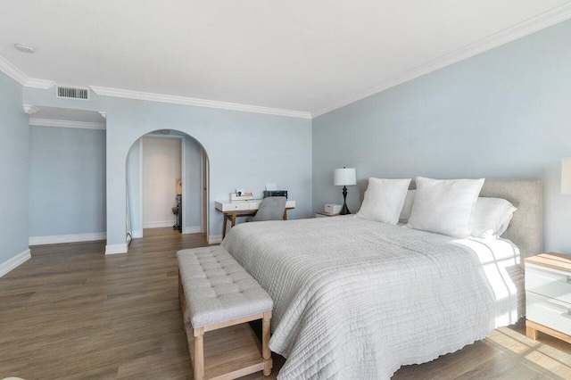 bedroom featuring dark hardwood / wood-style flooring and crown molding