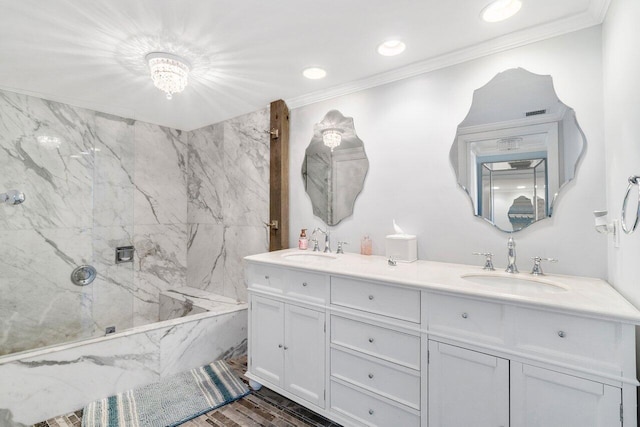 bathroom with hardwood / wood-style floors, shower with separate bathtub, vanity, and crown molding