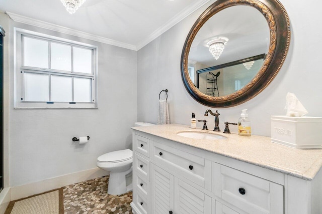 bathroom with toilet, vanity, tile patterned flooring, and crown molding