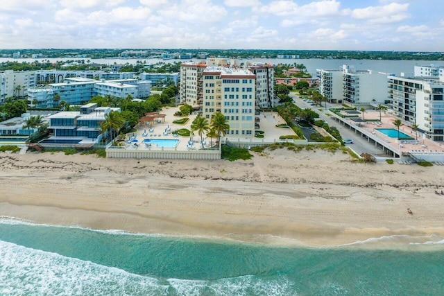 bird's eye view featuring a beach view and a water view