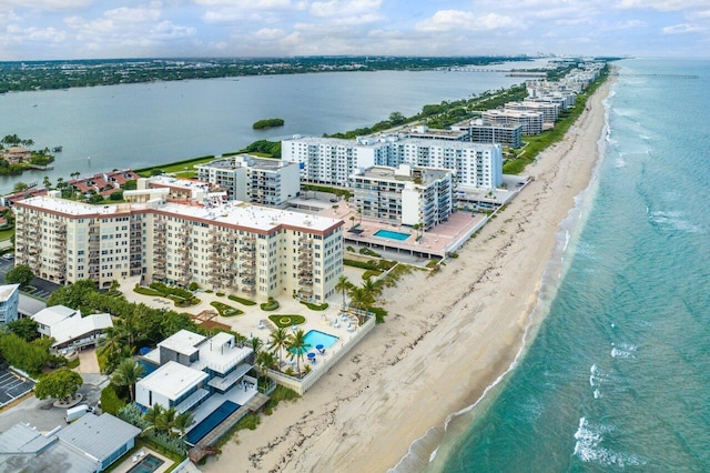 drone / aerial view featuring a view of the beach and a water view