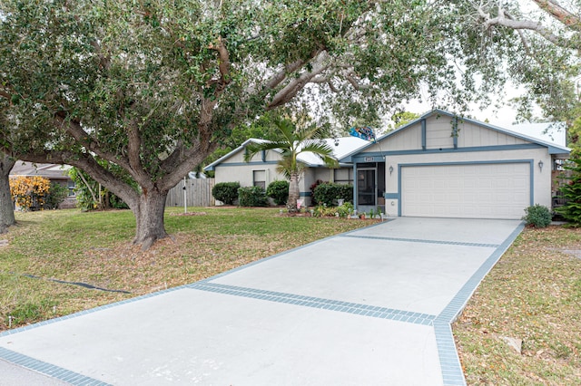 ranch-style home with a garage and a front lawn