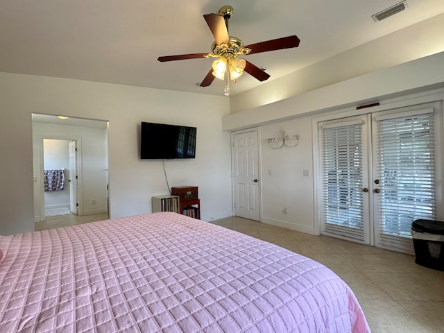 tiled bedroom with access to exterior, ceiling fan, and french doors