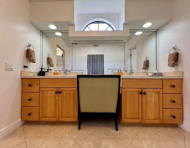 bathroom featuring tile patterned flooring and vanity