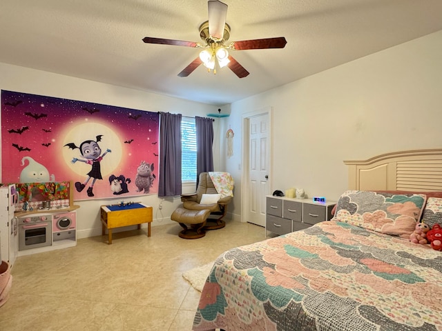 tiled bedroom with a textured ceiling and ceiling fan