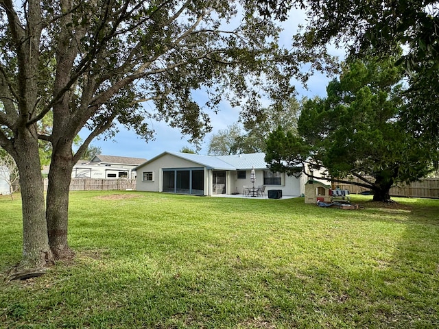 view of yard with a patio and central air condition unit