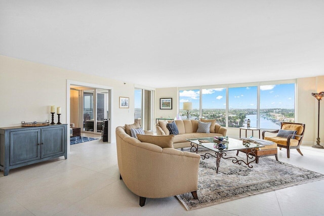 living room with a water view and floor to ceiling windows