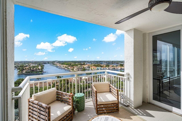 balcony featuring a water view