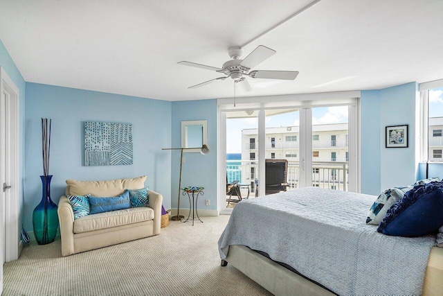 bedroom with access to exterior, carpet floors, and ceiling fan