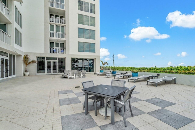 view of patio / terrace with an outdoor living space and a balcony