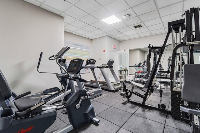 workout area featuring a paneled ceiling