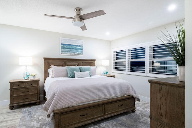 bedroom with hardwood / wood-style floors and ceiling fan