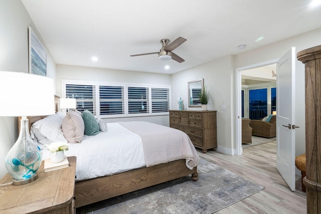 bedroom featuring light wood-type flooring and ceiling fan