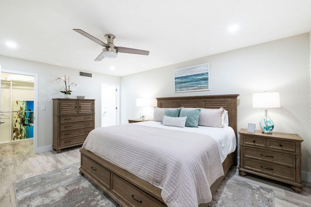 bedroom featuring light hardwood / wood-style floors and ceiling fan