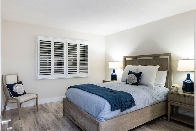 bedroom with wood-type flooring