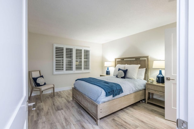 bedroom with light hardwood / wood-style floors